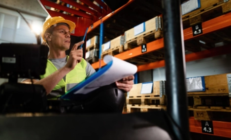 Worker ensuring details of specialty freight